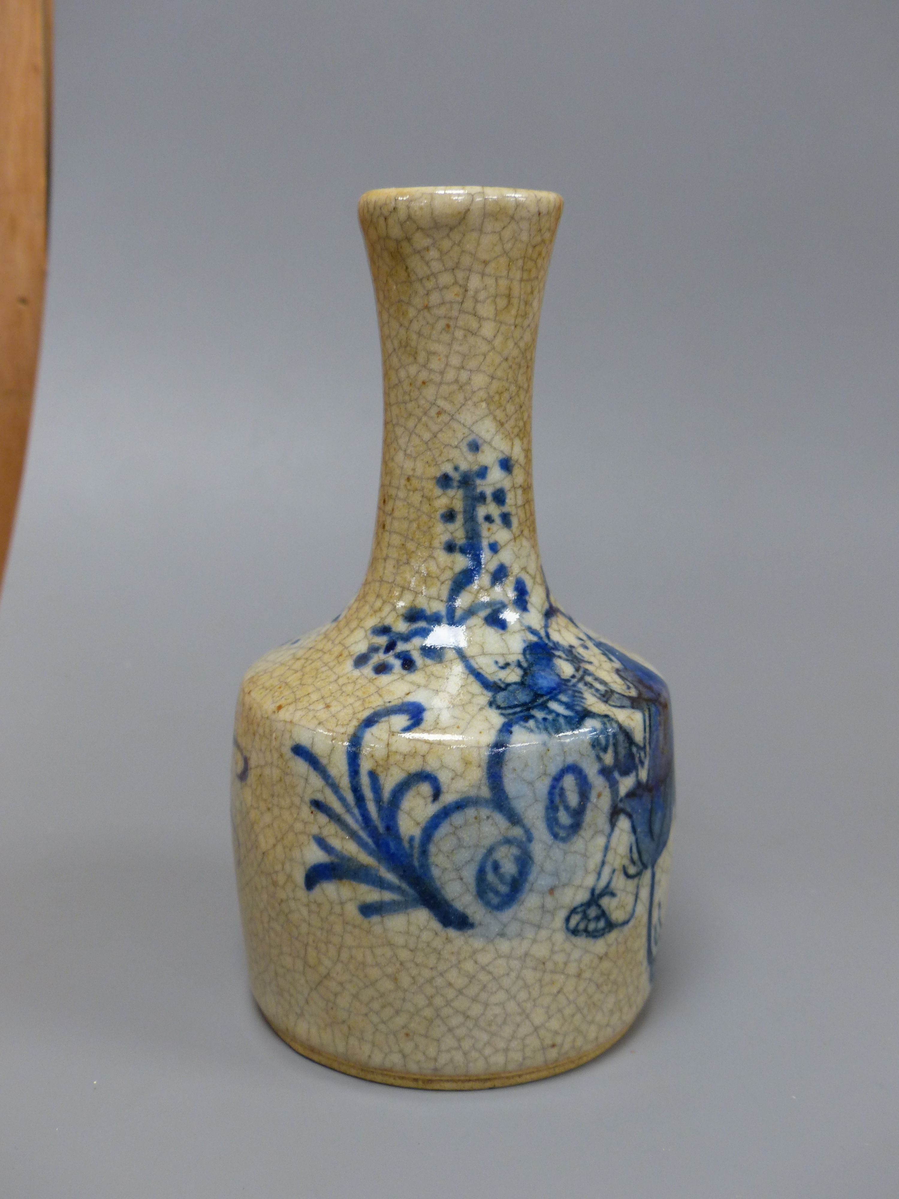 A Chinese blue and white crackle glaze bottle vase, height 15cm